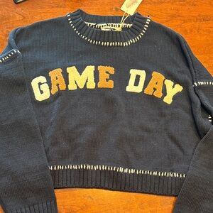 Jessica Simpson Navy Game Day Sweater Navy blue with white and tan letters.